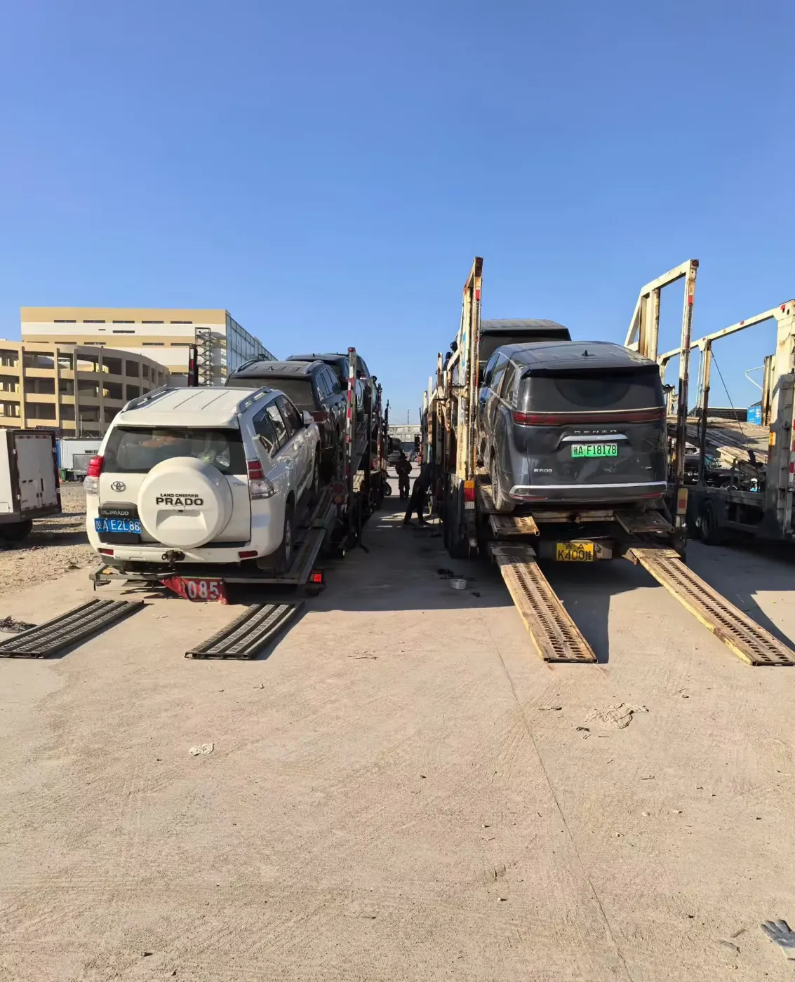 Vehicles loaded on a car-carrier truck for export transport to port