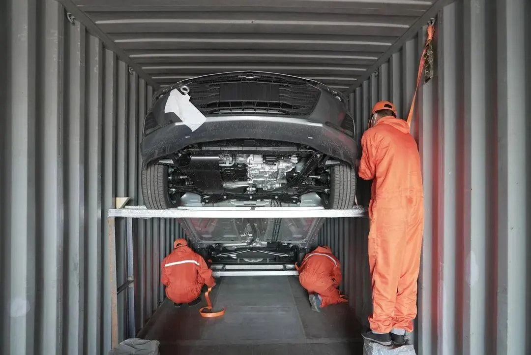 Vehicle being lashed inside a shipping container