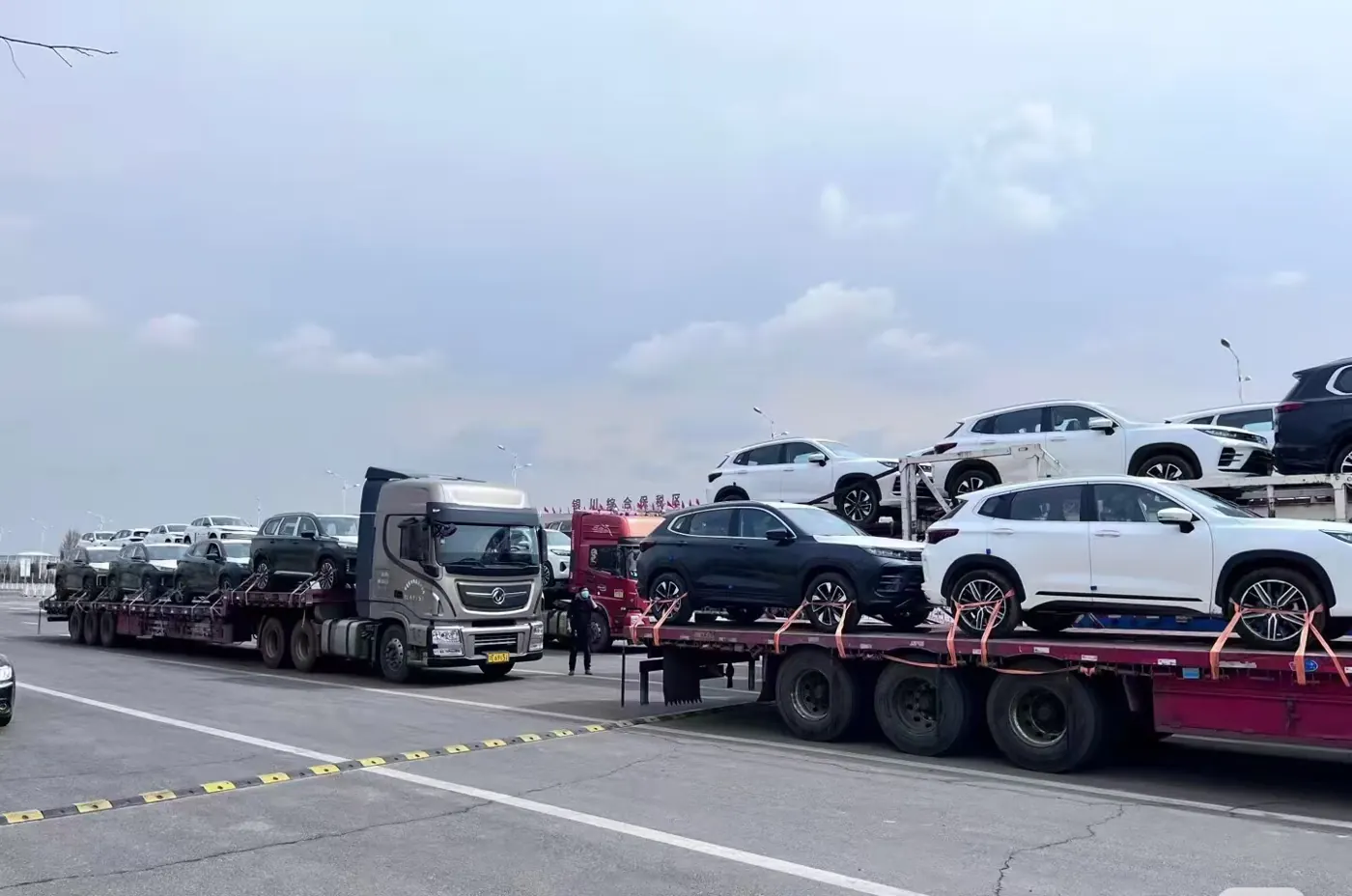 SUVs on a transport trailer before export